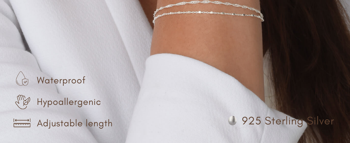 woman wearing a double chain bracelet in silver, 2 mixed chains, sattelite chain 